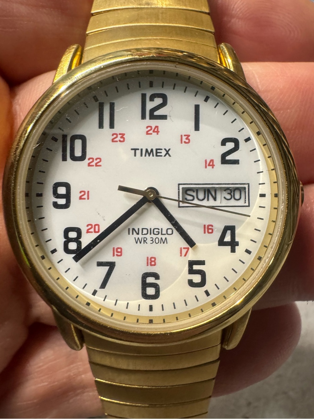 Timex Gold Tone Watch with White Dial and Black Numerals